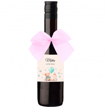 Piccola bottiglia di vino con fiocco rosa e adesivo personalizzato per battesimo